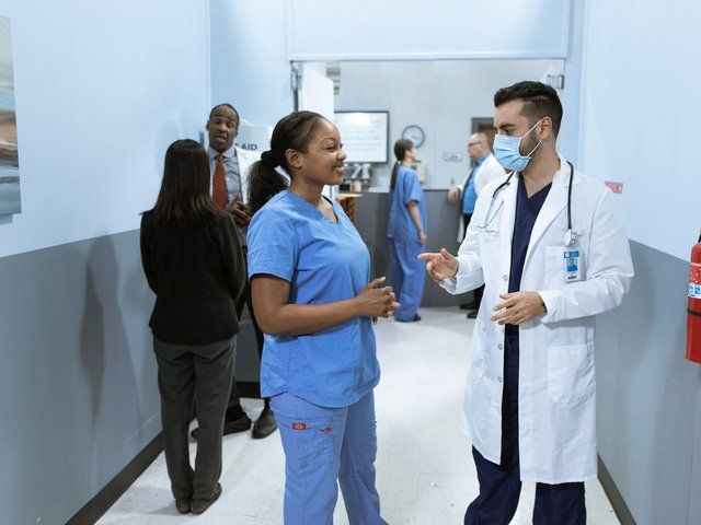 Hospital hallway where visitors can practice hands-only CPR at a kiosk
